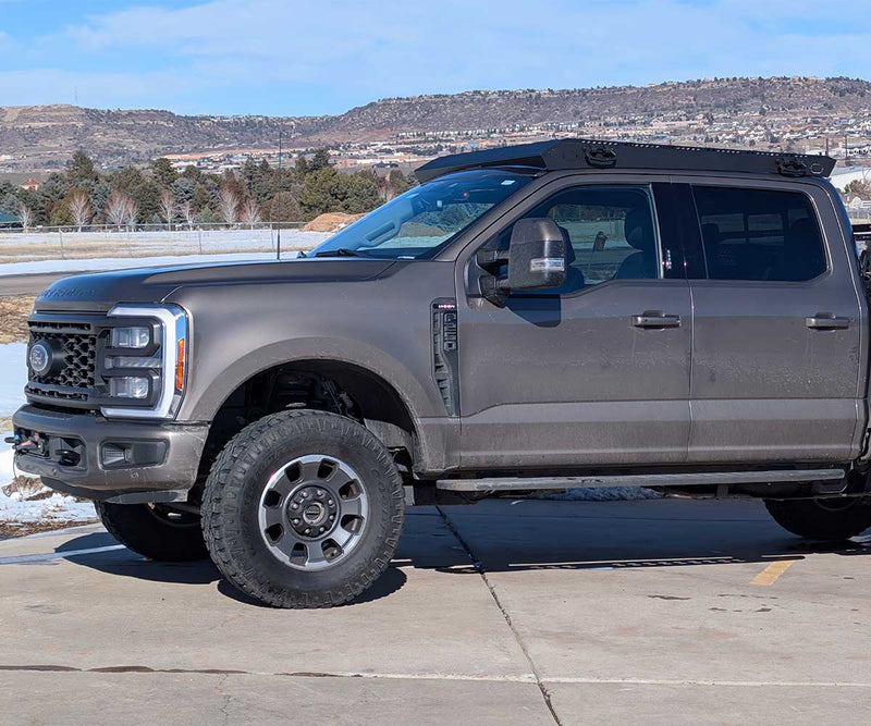 Load image into Gallery viewer, Kilo 5G F250 roof rack on 2020-2026 Ford F250-F450 with low-profile black anodized design
